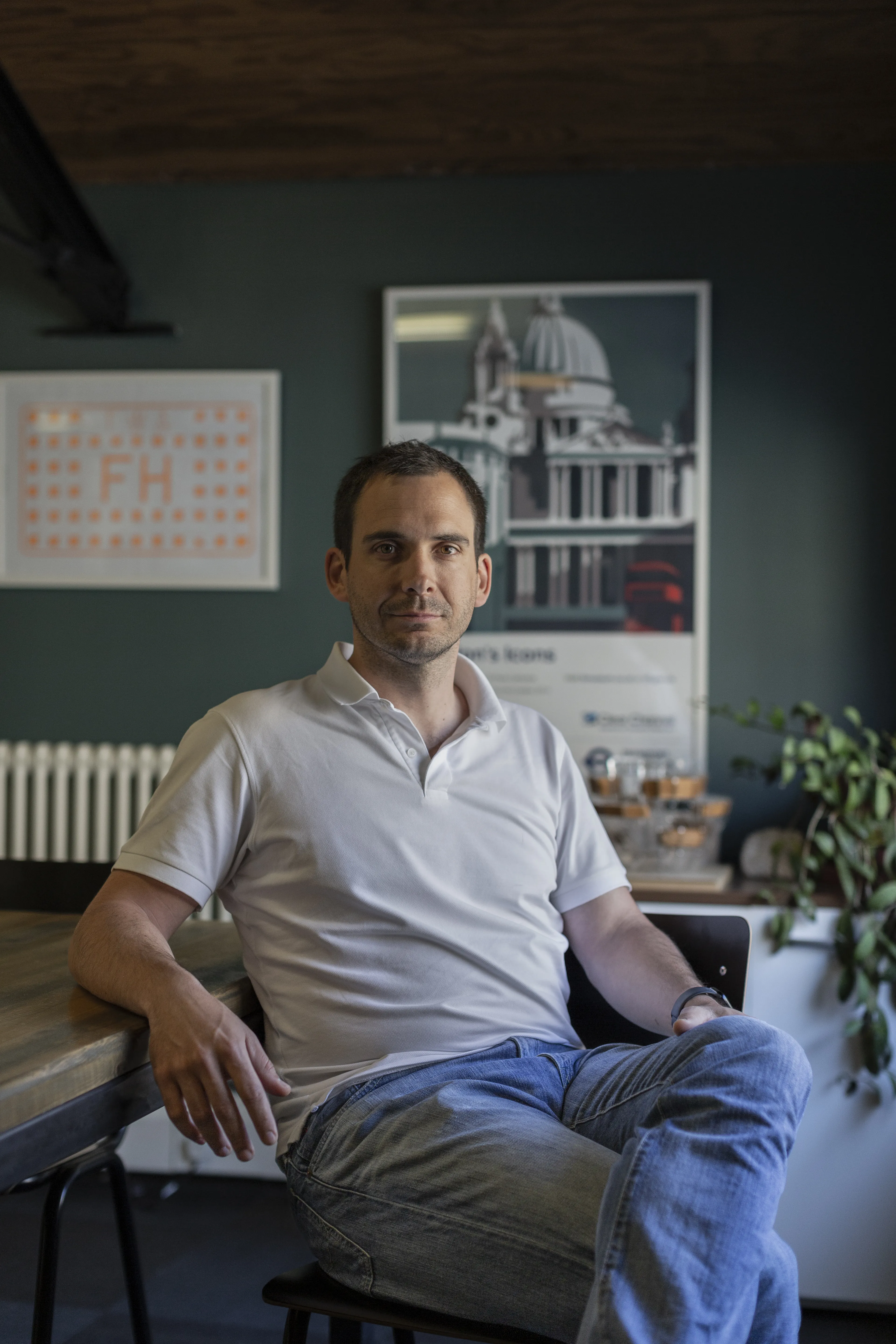 Alfonso Monedero seated in office